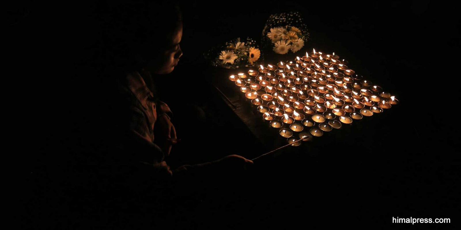 Butter lamps lit in honor of Nepali students killed in Israel [In Pictures]